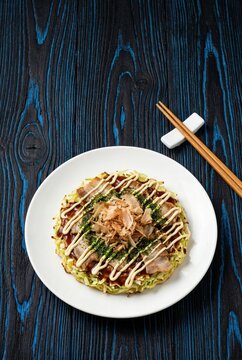 Generated ai Okonomiyaki, Japanese pizza, with cabbage and pork.