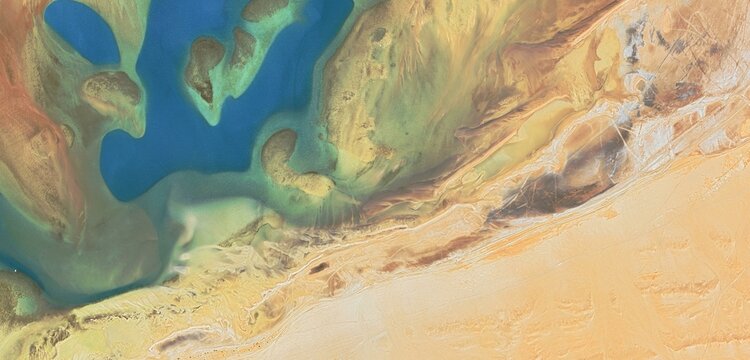 Abstract Aerial View of Blue Desert Lake and Salt Patterns in Saudi Arabia