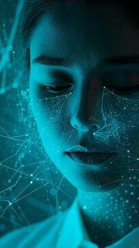 Vertical video: Turning woman closing eyes as mesh expanding across face in studio for face mapping