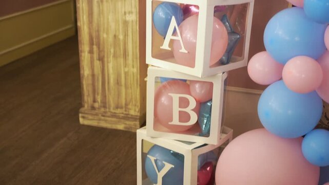 photo zone with pink and blue balloons for gender party