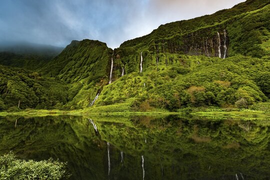 Waterfalls with lake Po&ccedil;o Ribeira do Ferreiro in green landscape, Poco da Alagoinha, Faj&atilde;zinha, Flores Island, Azores, Portugal