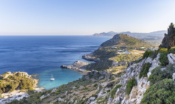 View over the coast of Rhodes, sailing boat in a bay, Rhodes, Dodecanese, Greece