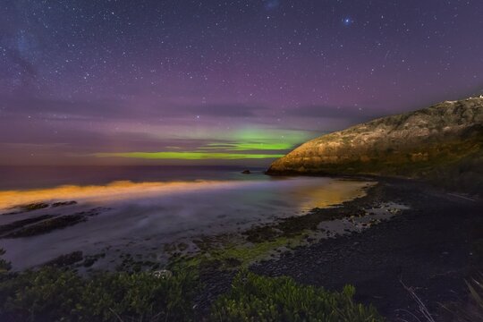 Southern lights, aurora australis over the sea, sand dunes, Second Beach, Dunedin, Otago, Southland, New Zealand