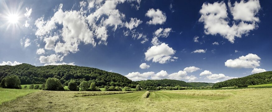 Panoramic view of a hay meadow and cloudy sky, Altmuehltal Valley near Obereichstaett, Bavaria, Germany, Europe
