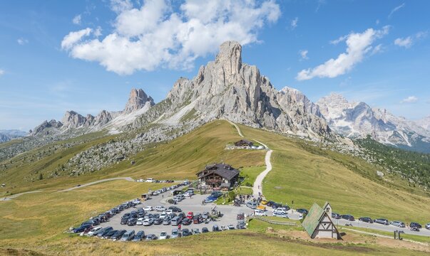 Parking lot with guesthouse, Passo di Giau, Giau Pass, at the back peaks of La Gosela Nuvolau and Averau, on the right Tofane, Dolomites, South Tyrol, Trentino-Alto Adige, Italy