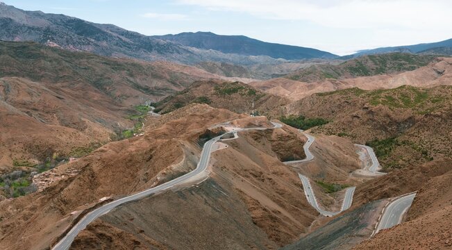 Curvy mountain pass in serpentines over the Atlas Mountains, mountain pass Tizi N'Tichka, barren landscape, High Atlas, Morocco