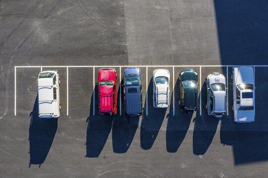Drone shot, parking lot, parked cars side by side from above, Norway