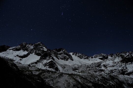 Starry sky with snow-covered Alpine peaks, Gramais, Lechtal, Reutte, Tirol, Austria, Europe