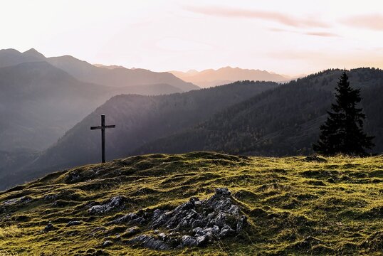 Summit cross at sunset near the Blauberg Alm, Tirol, Austria, Europe