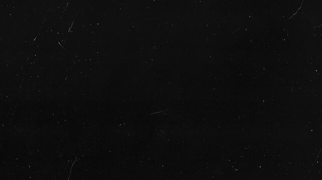 Black background with sparse dust and faint scratches