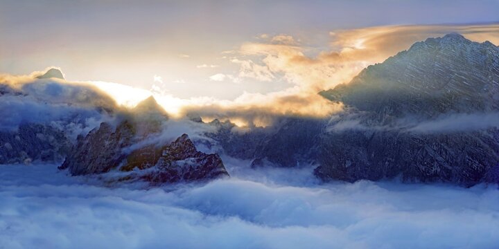 Watzmann east wall and Hunstod at sunset, rising from a sea of clouds above Lake K&ouml;nigssee, viewpoint Feuerpalfen, Berchdesgarden National Park, Sch&ouml;nau am K&ouml;nigssee, Berchtesgaden, Bavaria, Germany