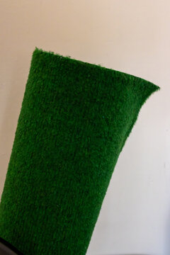 Green carpet texture on neutral background