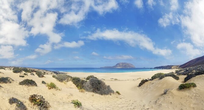 Dune landscape, Playa de las Conchas with volcano Monte Bermeja, island Monta Clara in the background, La Graciosa, Lanzarote, Canary Islands, Spain