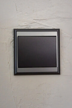 Modern wall switch panel on textured wall