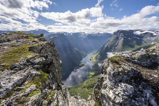 Rock cliffs, view from the top of Breiskrednosi, mountains and fjord, N&aelig;r&oslash;yfjord, Aurland, Norway