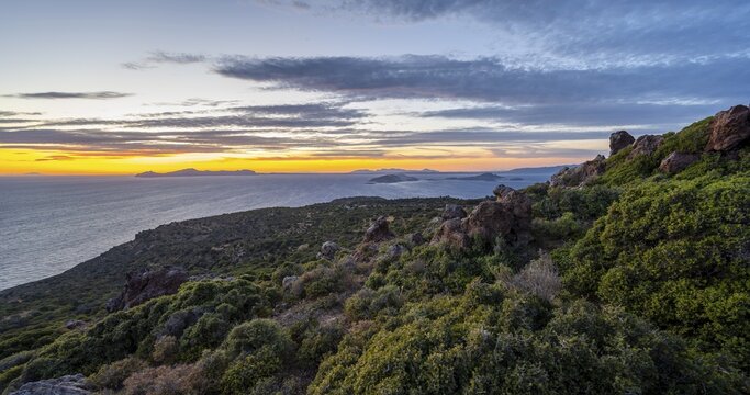 Sunset over the sea, landscape with macchia, in the back islands Gyali and Kos, Nisyros, Dodecanese, Greece