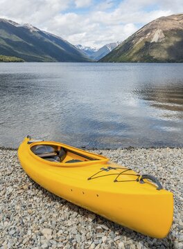 Yellow Kayak lying on the beach, Lake Rotoiti, Nelson Lakes National Park, Tasman District, South Island, New Zealand