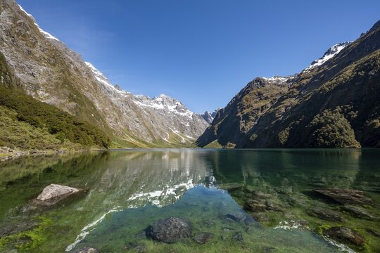 Reflection in Lake Marian, Fiordland National Park, Te Anau, Southland, South Island, New Zealand
