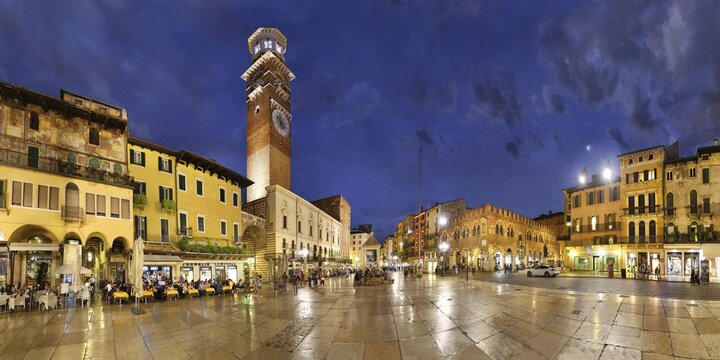 City square Piazza delle Erbe and former Roman Forum with fountain Fontana Madonna Verona and the medieval tower Torre dei Lamberti in the evening, Piazza Erbe, Verona, Veneto, Italy