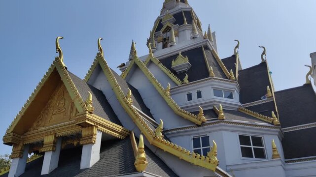 Kota, Rajasthan, India 5 March 2026: Footage of Thailand temple miniature shot at Chambal Riverfront of Kota against a beautiful sky in background during daylight
 
