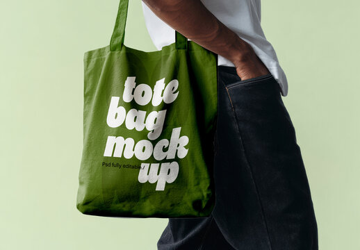 Tote Bag Mockup In Hand With Solid Background Studio Setup