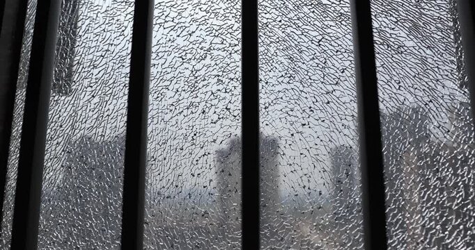 Broken window glass of modern apartment