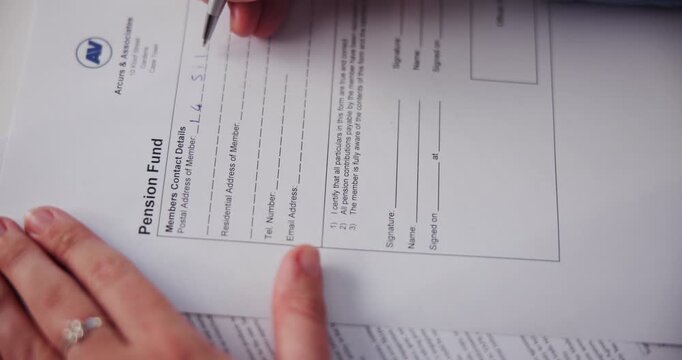 Person, hands and writing on law agreement paperwork for pension fund, retirement investment and application contract. Compliance, document and client information form with insurance or personal data