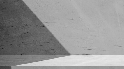 Fototapeta premium Modern gray cement floor with natural light and shadow.Dark gray concrete wall with aesthetic diagonal shadow.Empty cement podium for luxury product display mockup.