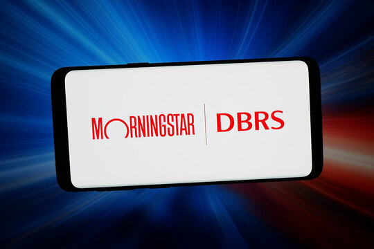 Stuttgart, Germany - 03-18-2026: In this photo illustration, the logo of credit rating agency Morningstar DBRS is displayed on a smartphone in front of abstract background on computer screen.