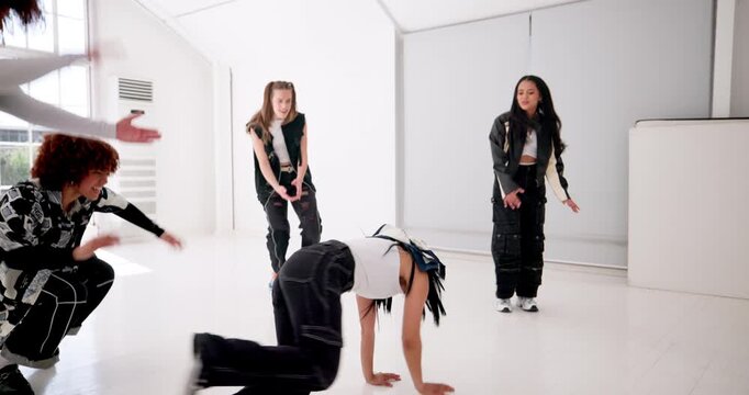 Breakdance, creative and music with people in studio for choreography, rehearsal or training together. Art, dancing and music with group of friends in class for learning, lesson or practice routine