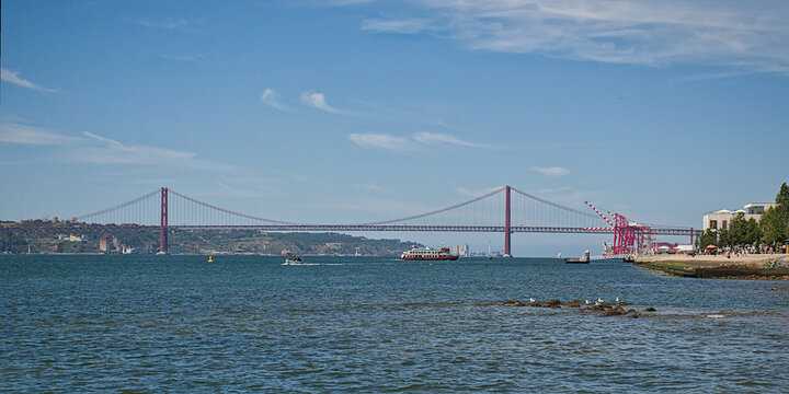 25 de Abril Bridge over Tagus river in the port of Lisbon, Portugal
