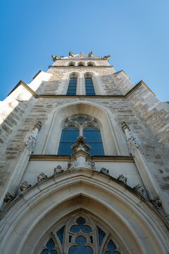 View of the grand cathedral rises with intricate stonework, soaring towards the clear blue sky, a display of architectural majesty, Vaduz, Vaduz, Liechtenstein.