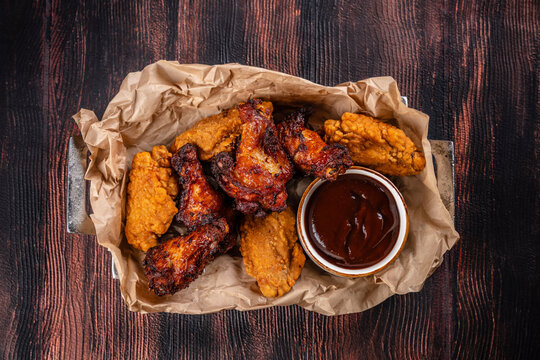 Top view fried and grilled chicken wings with barbecue sauce