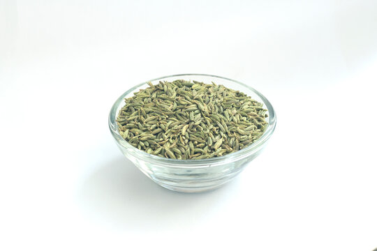 fennel seeds - saunf variyali in small glass bowl isolated on white background