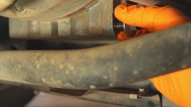 Close up changing the oil on a car