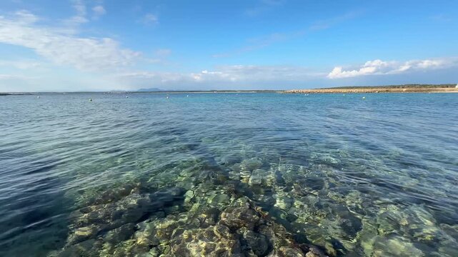 view of the sea and coastline from the sea on a spring day with blue sky