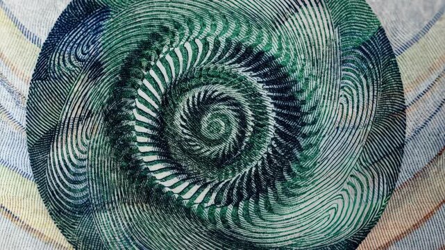 Closeup of a multidimensional security feature on a banknote captured with angled lighting that enhances embossed details sharp focus on the features.