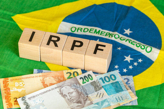 IRPF, Imposto de Renda de Pessoa F&iacute;sica, English translation Personal Income Tax. Financial concept. Taxes in Brazil. written on wooden blocks, Brazilian flag, business background