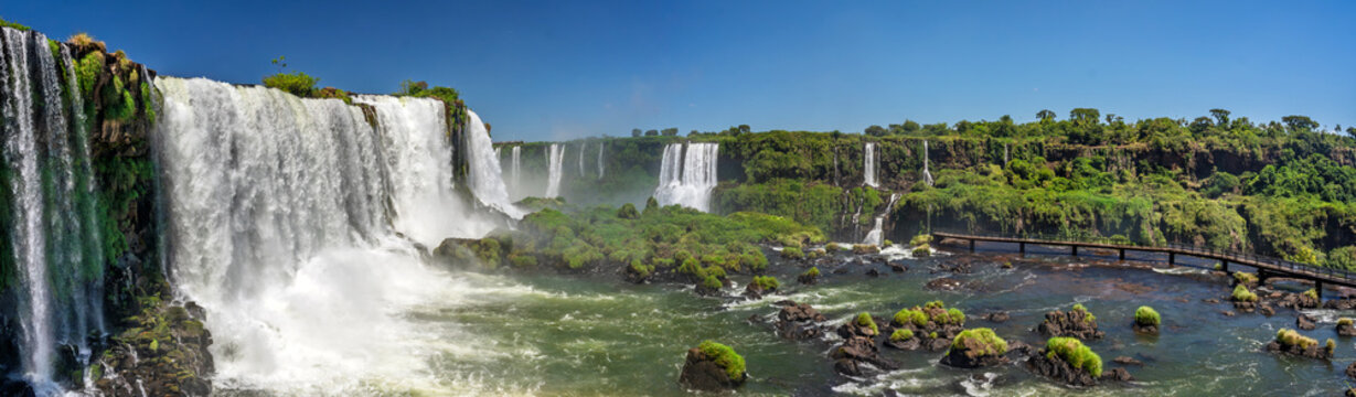 Iguazu Falls Brazil wide panorama of powerful cascades green jungle islands and misty subtropical landscape