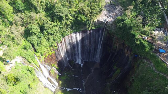 Breathtaking aerial view of the majestic Tumpak Sewu waterfall in East Java.
