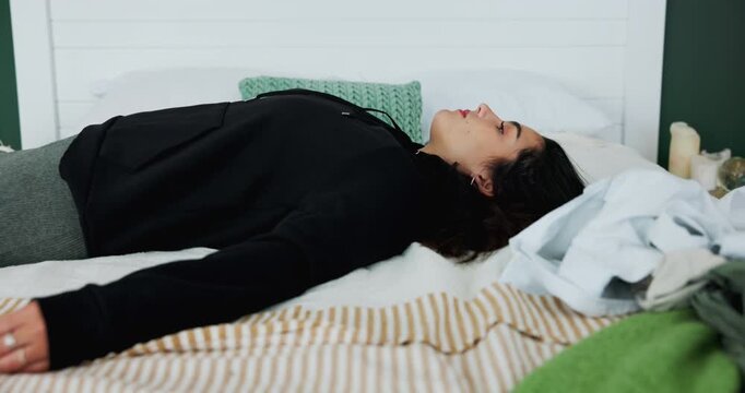 Frustrated, throw and woman in bedroom tired of depression, anxiety and worry for debt crisis in home. Fatigue, sad person and lonely girl sleeping with broken heart, emotional burnout and stress
