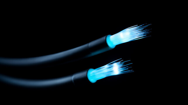 Close up vibrant blue light fiber optic cable technology on dark background for data transmission and high-speed internet network concept