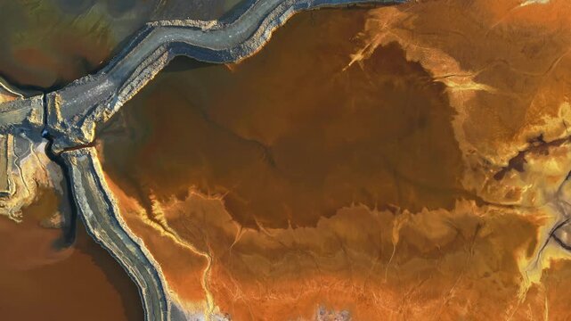 Colorful earth patterns along dirt road in huelva