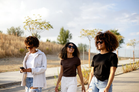 Friends walking outdoors on a sunny day