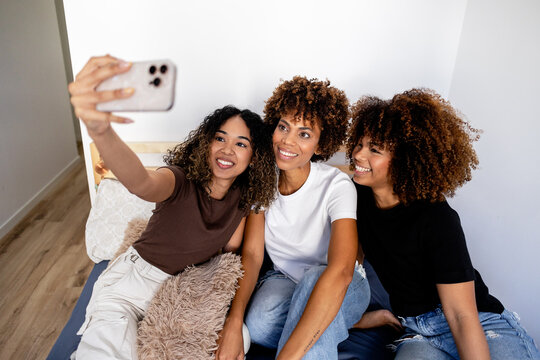 Friends enjoying a selfie moment together indoors