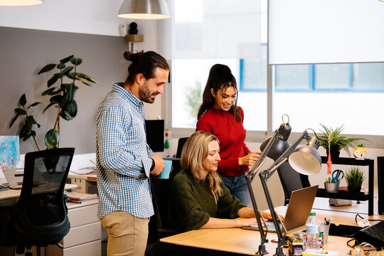 Colleagues collaborating in a modern office environment