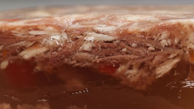 Meat aspic, slavic food, Traditional Russian pork meat aspic Kholodets with horseradish, mustard, jellied jelly beef, eating in restaurant chicken tasty dish. Close up on kitchen. 