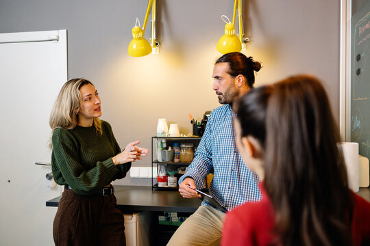 Office colleagues collaborating in a modern coworking space