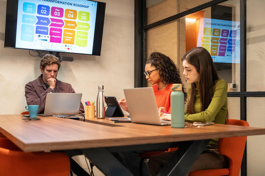 Diverse team collaborating in modern coworking space