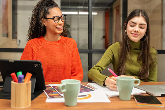 Multiethnic team collaborating at a modern coworking space
